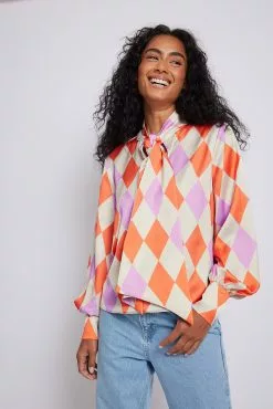 Karoline Dall X NA-KD Printed Satin Bow Blouse